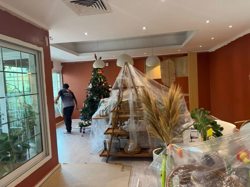 Painting Services in JLT 1 Professional painter working inside a JLT apartment - Emirates Painting Services